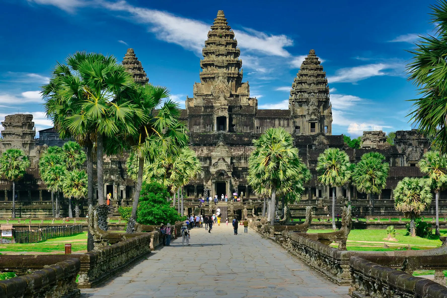 Angkor Wat towers and palm-lined entrance